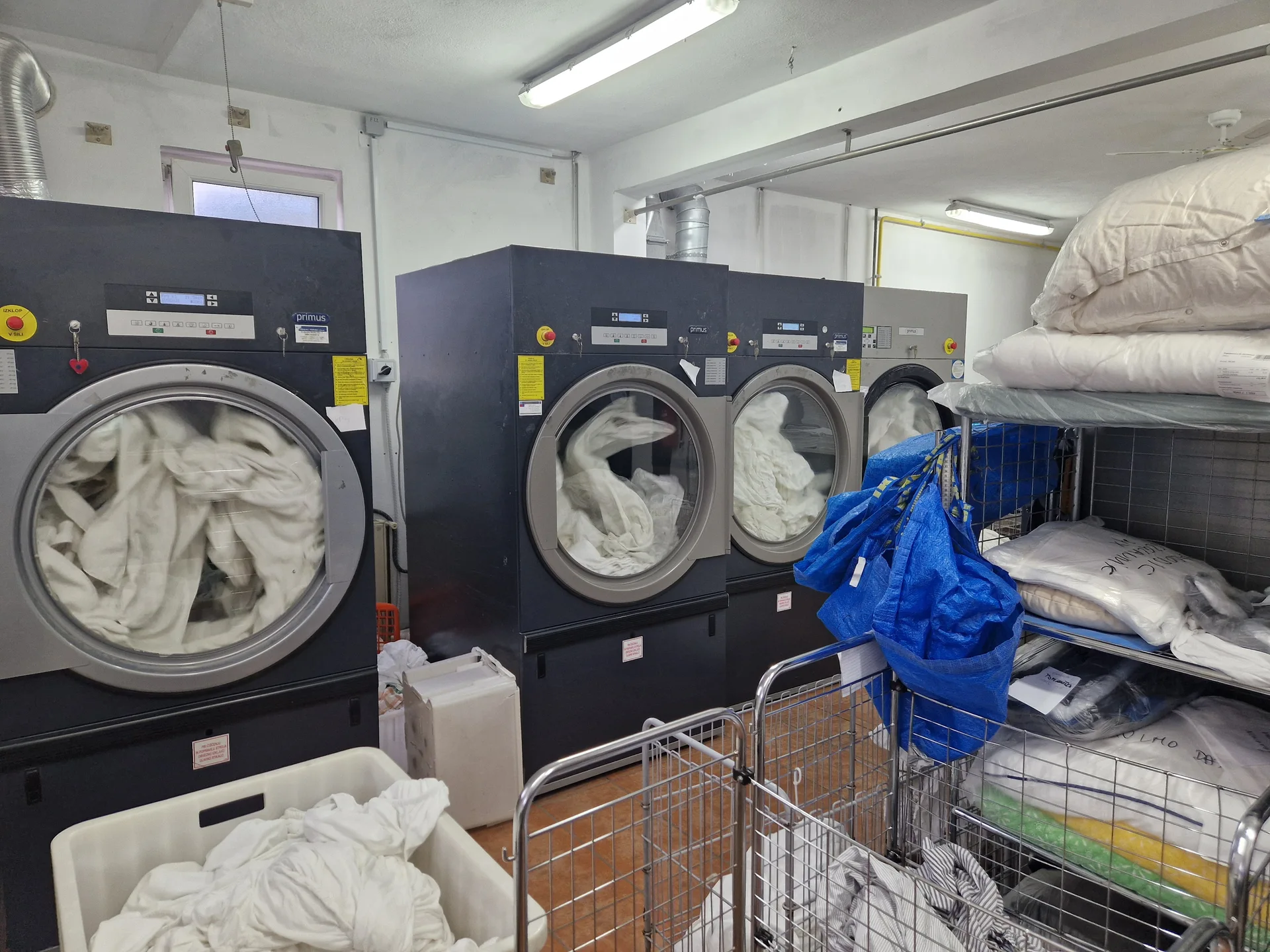 Professional machines and laundry at a local laundry